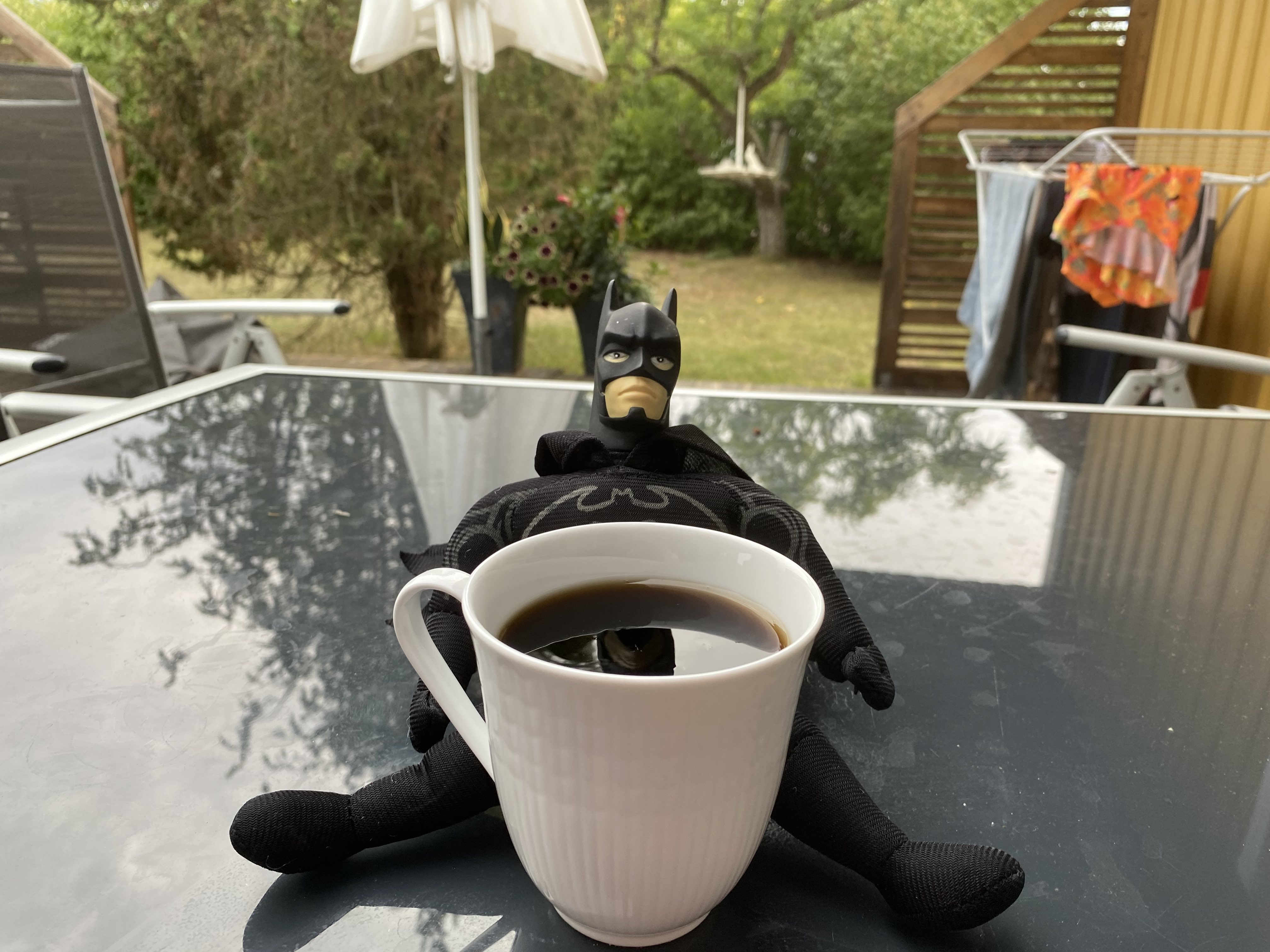 Batman drinking coffee
